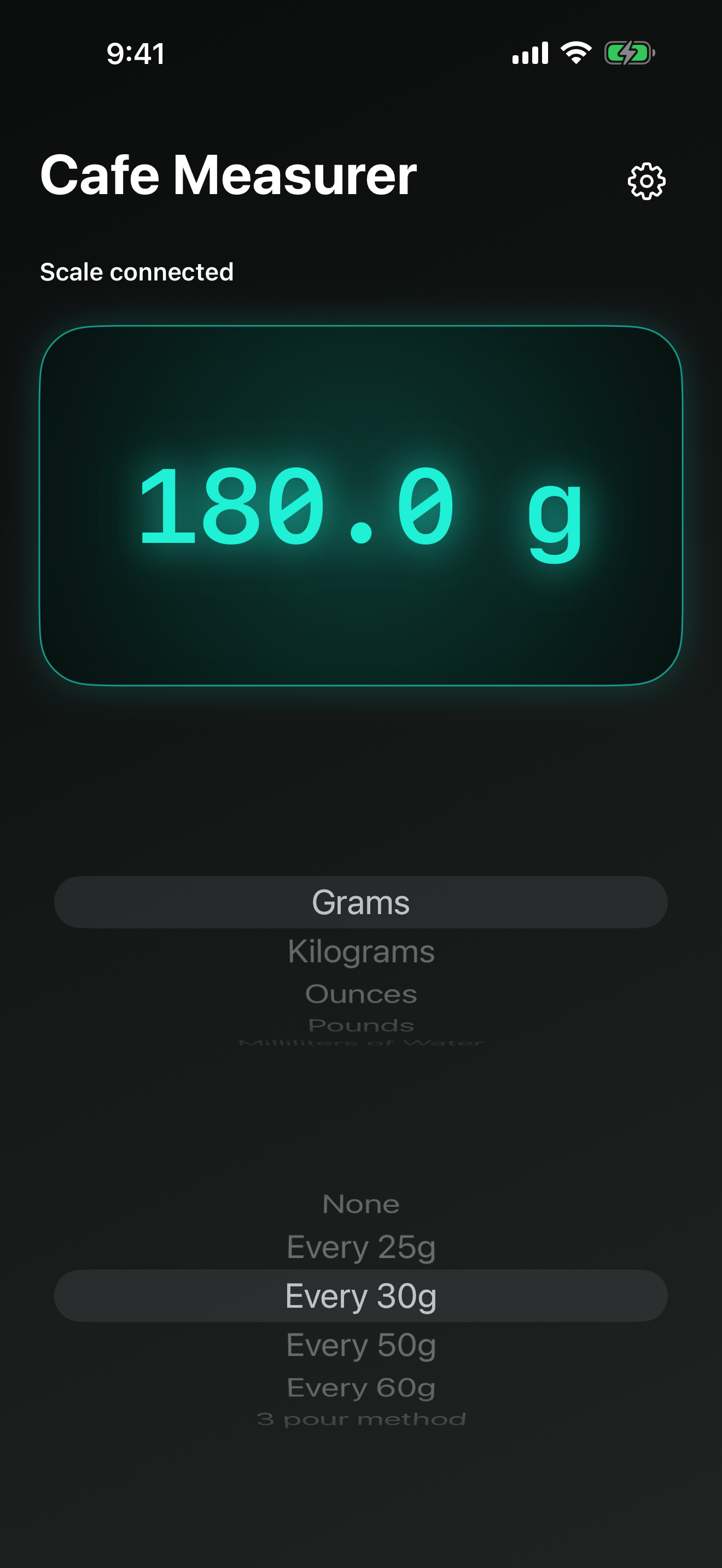 Cafe Measurer showing a settled 180 gram reading in bright teal on a dark background.